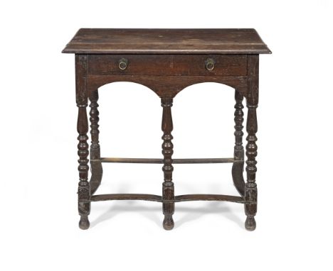 A 17th century oak side tableWith single long drawer and raised on five legs, united by concave stretchers, formerly the base