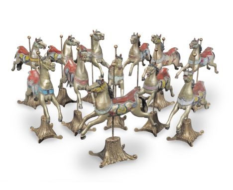 Attributed to Arthur Ernest Anderson (d. 1936) of Bristol: A set of twelve carved and polychrome wood carousel horsesProbably