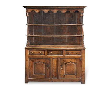 A mid or third quarter 18th century oak dresserAlmost certainly of Northern Welsh originThe moulded cornice above a waved apr