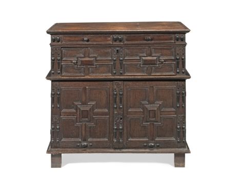 A Charles II oak and ebonised moulded chestApparently largely restored during the 19th centuryWith applied engaged ring turne