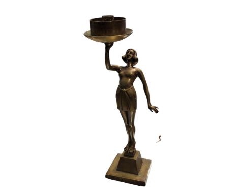 An Art Deco bronzed side light, of a lady, standing, topless,&nbsp; holding aloft a dish, square base,&nbsp; 38cm high, marke