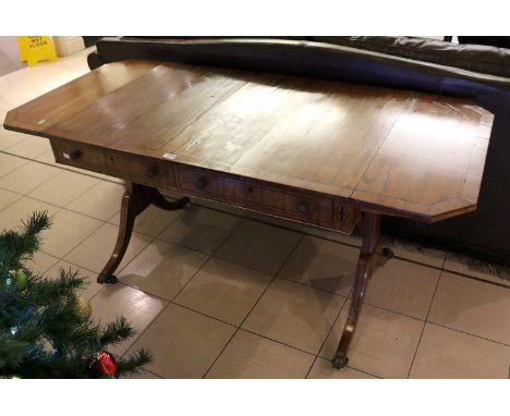 A 19th Century Rosewood Sofa Table, the twin supports terminating in brass paw feet, moving on castors, 159cm by 71cm by 71cm