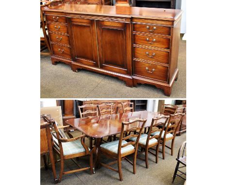 A Reproduction Mahogany Assembled Dining Suite, comprising a set of eight ladder-back dining chairs, a twin pedestal dining t