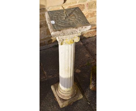 A 20th Century Weathered Composition Sundial, of Corinthium columnar form, 84cm high, together with a cast iron boot scraper 