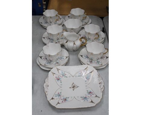 A VINTAGE SHELLEY HANDPAINTED DAINTY SHAPE TEACUPS AND SAUCERS TO INCLUDE SUGAR, CREAMER, CAKE/BREAD AND BUTTER PLATE 