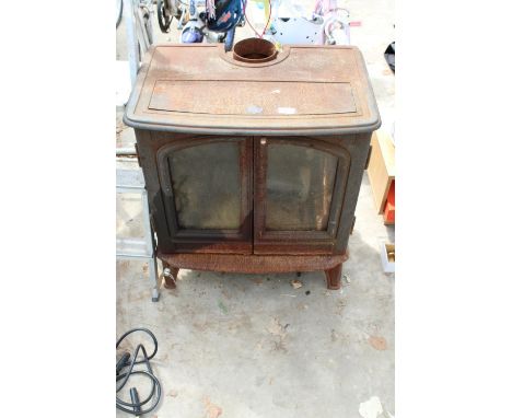 A LARGE VINTAGE HEAVY CAST IRON LOG BURNER 