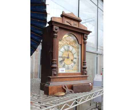 A DECORATIVE MAHOGANY CHIMING MANTLE CLOCK 