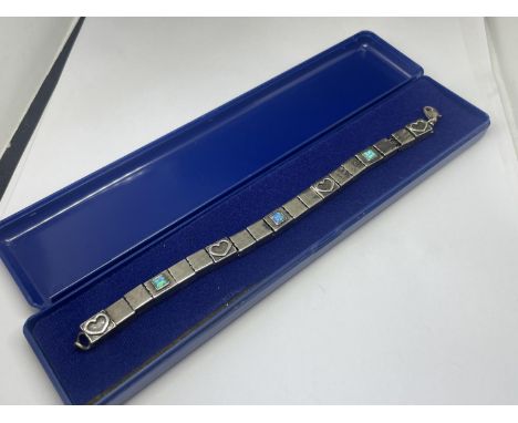 A SILVER AND MOTHER OF PEARL BRACELET IN A PRESENTATION BOX 