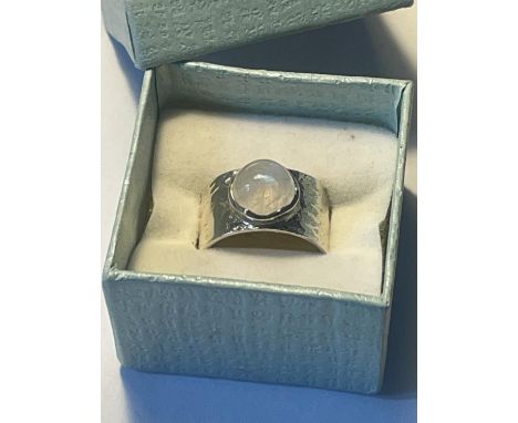 A SILVER RING WITH OPAQUE STONE IN A PRESENTATION BOX 