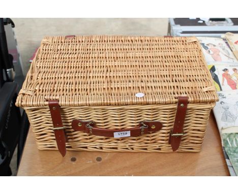 A WICKER PICNIC HAMPER BASKET 