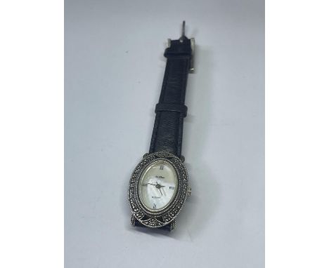 A SILVER WRIST WATCH 