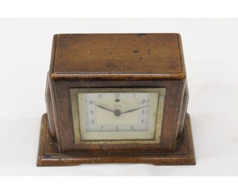 A 1930S, WOODEN, ART DECO MANTLE CLOCK WITH BAKELITE BACK 