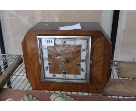 A WALNUT CASED WESTMINISTER CHIMING MANTLE CLOCK 
