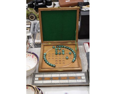 A BOXED WOODEN SOLITAIRE BOARD WITH MARBLES PLUS A VINTAGE CRIBBAGE BOARD 