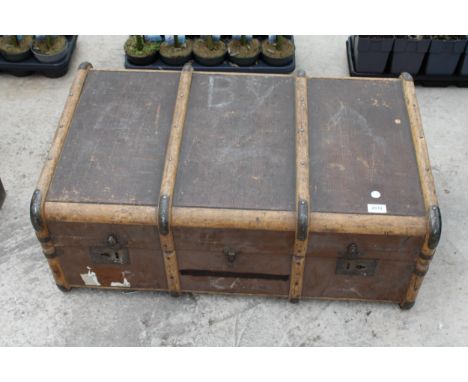 A VINTAGE COMPRESSED FIBRE TRAVEL TRUNK 