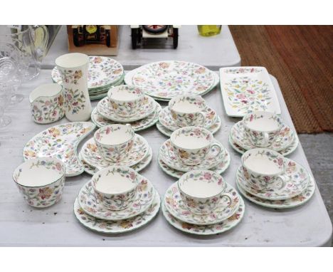 A LARGE MINTON "HADDON HALL" TEA SET TO INCLUDE CUPS, SAUCERS, SIDE PLATES, CAKE PLATES, SUGAR BOWL ETC 