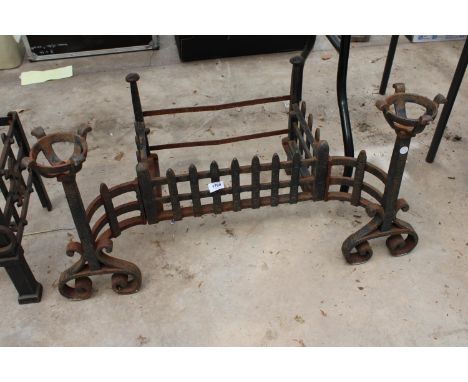 A VINTAGE CAST IRON FIRE GRATE WITH LARGE ATTATCHED FIRE DOGS 