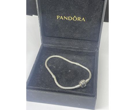 A SILVER PANDORA BRACELET IN A PRESENTATION BOX 