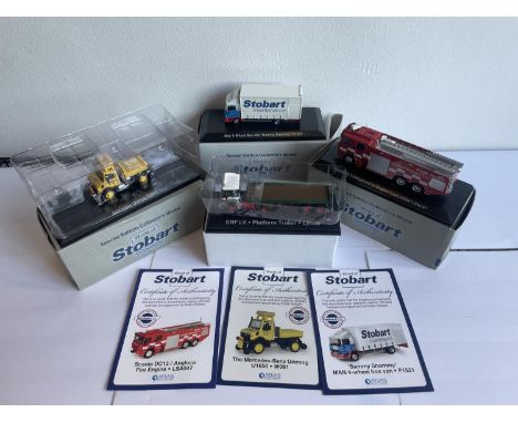 FOUR BOXED STOBART VEHICLES TO INCLUDE A UNIMOG, FIRE ENGINE AND TWO WAGONS THREE WITH COA 