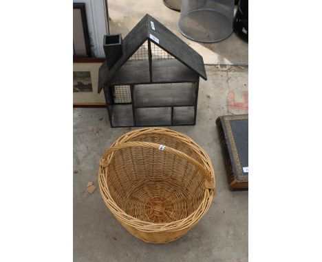 A METAL HOUSE SHAPED WALL SHELF AND A WICKER BASKET 