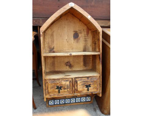 A RUSTIC PINE WALL SHELF WITH ARCHED TOP, TWO DRAWERS AND TILED BOTTOM RAIL WITH HOOKS, 19" WIDE 