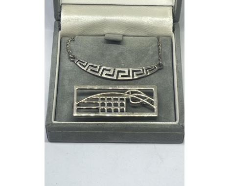 A SILVER MACINTOSCH NECKLACE AND BROOCH 