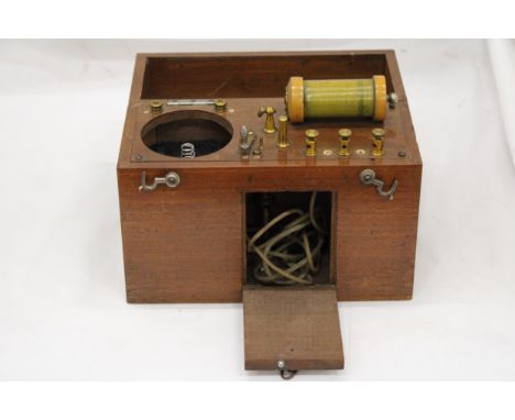 A VINTAGE ELECTRONIC MEDICAL APPLIANCE - IN OAK CASE 