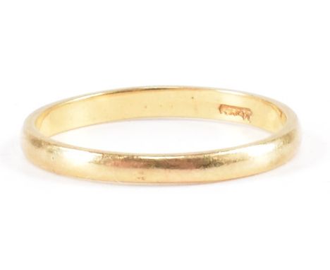 A gold plain wedding band. Marked 18ct to band. Weight 1.5g. Size K.&nbsp;