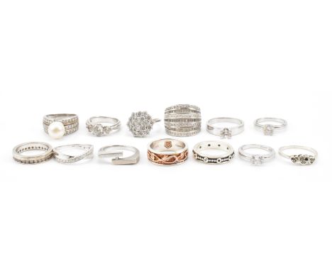 A group of thirteen silver rings. The lot to include a selection of solitaire white stone rings,&nbsp;a three white stone gra