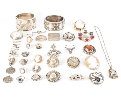 A collection of Victorian and later silver and white metal jewellery. The lot to include a Scottish silver specimen brooch (A