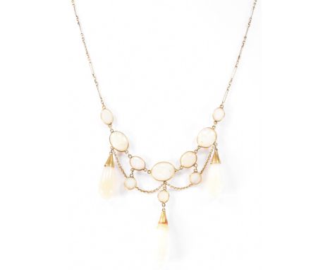 A vintage gilt metal garland opal necklace. The necklace having oval opals, suspended by garland trace chains and connected b