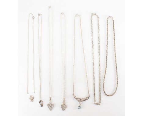 A group of seven vintage silver necklaces. The lot to include a heart pendant necklace, a hallmarked rope twist necklace, a h