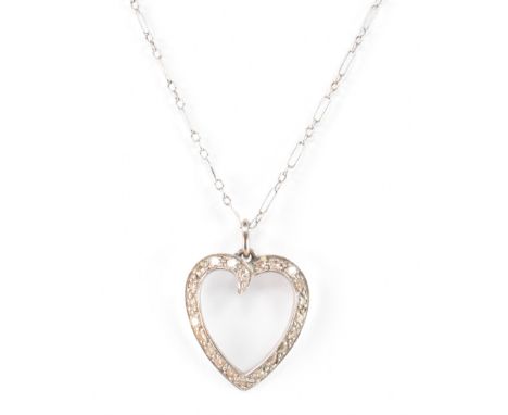 A 14ct white gold necklace and diamond heart pendant. The gold heart form pendant having single cut diamond surround on a gol