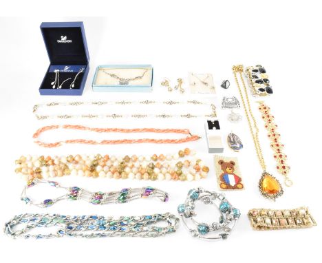 A selection of vintage costume and silver jewellery. The lot includes various earrings and necklaces including silver and a v