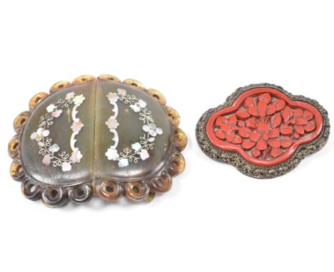 An early 20th Century antique Chinese tortoise shell and mother of pearl belt buckle together with a Chinese white metal and 