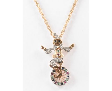 A hallmarked 9ct gold pendant necklace. The necklace having a rope twist chain with an articulated pendant featuring a clown 