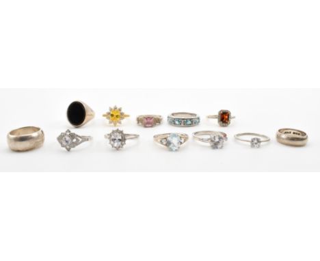 A group of twelve silver rings. The lot to include a selection of coloured stone dress rings and two band rings. All marked s