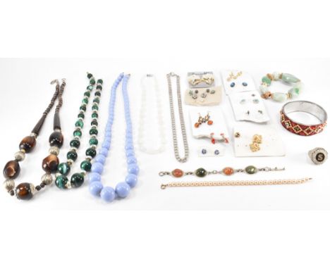 An assortment of vintage costume jewellery. The lot to include beaded necklaces, simulated pearls, a flat link necklace chain