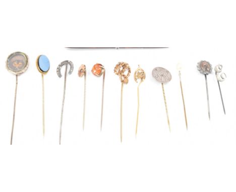 A collection of 19th Century Victorian and later stick pins. The lot to include two horse shoe stick pins, a wish bone stick 