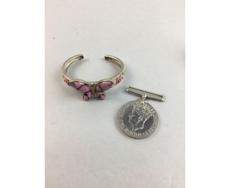 SILVER BUTTERFLY MOTIF BANGLE, with Birmingham hallmarks, along with a red gem necklace marked 925, two brooches, a 1939-45 w
