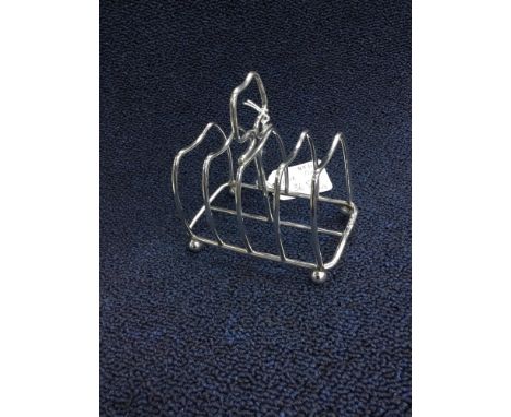 SILVER TOAST RACK AND A SILVER PLATED TEA SERVICE, along with a sugar shaker, the toast rack 110g, the tea service comprising