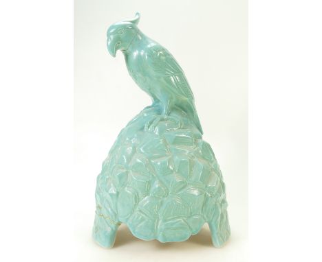 Doulton &amp; Co speaker cover of a parrot on rock in blue glazed colours, made for Artandia Ltd, height 38cm (parrots head a
