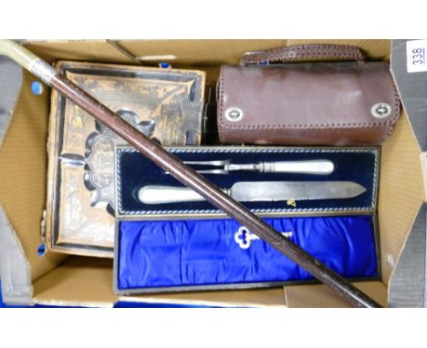 A mixed collection of items including early bound family bible, mother of pearl handled carving set, silver collared walking 