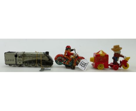Clockwork tinplate motorbike marked 'made in England', a similar Silverlink LNER train marked foreign, both with keys, togeth