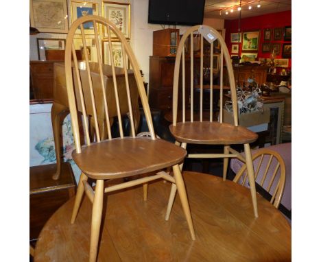 A set of six 1960s Ercol light elm dining chairs with solid seats on stretchered supports 