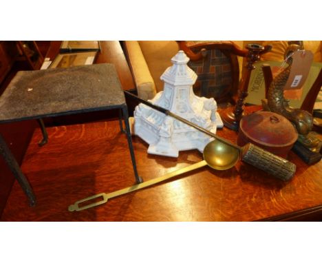 A collection of mainly 19th century items including a dolphin form doorstop, an iron trivet treen candlestick and other items