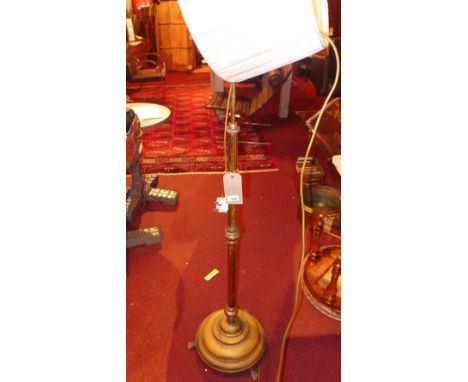 A Victorian brass standard lamp with shade 