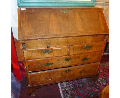 A late 18th century walnut bureau having fall front and three drawers on bracket feet (af)