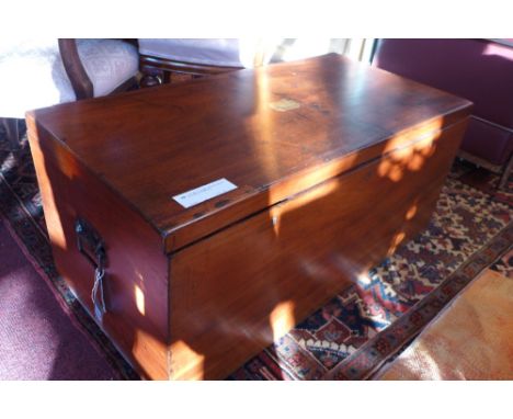 A 19th century mahogany and brass bound trunk with rising lid and candle box 
