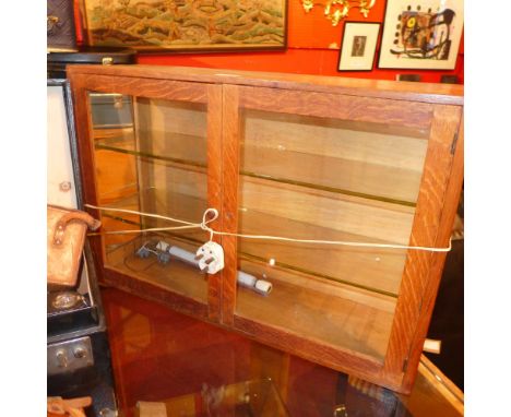 A cased set of scientific scales and an oak wall cabinet (2)